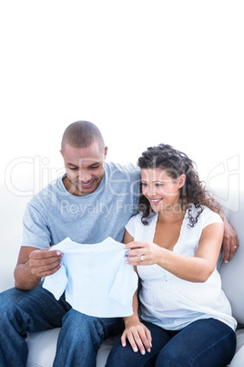 Happy couple looking at clothing