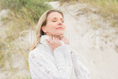 Woman smiling near the sandy hill