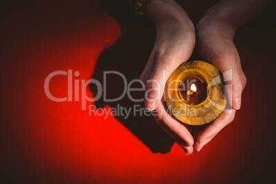 Fortune teller holding a candle