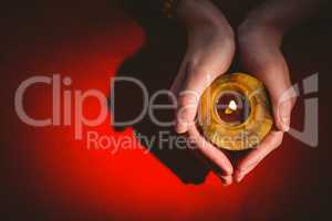 Fortune teller holding a candle