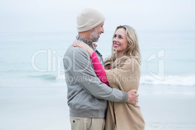 Cute couple standing and holding each other