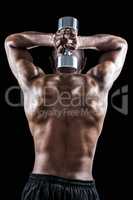 Rear view of muscular man lifting dumbbell