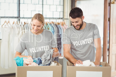 Volunteers separating donations clothes