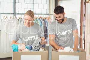 Volunteers separating donations clothes