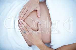 Pregnant woman touching her belly