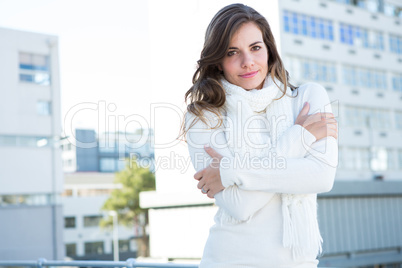 Pretty woman with warm clothes looking at camera