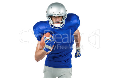 Confident American football player running with ball