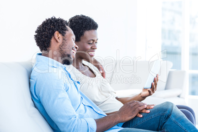 Husband and wife looking at tablet