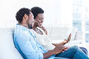 Husband and wife looking at tablet