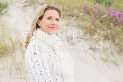 Woman smiling near the sandy hill