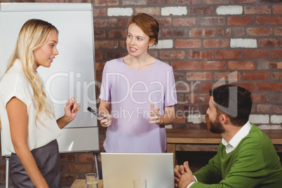 Business people having discussion during presentation