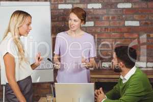 Business people having discussion during presentation