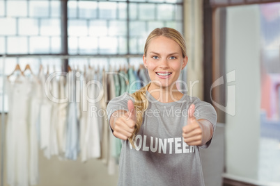 Portrait of smiling woman giving thumbs up