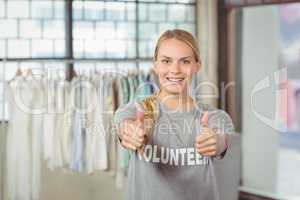 Portrait of smiling woman giving thumbs up