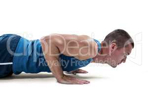 Man in sportswear doing push ups