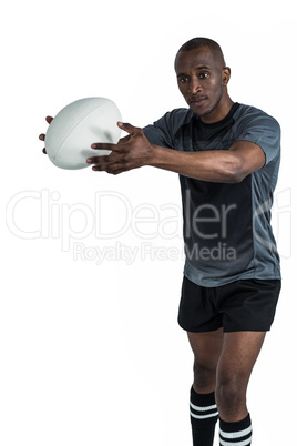Athlete in position to throw rugby ball