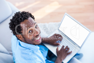 High angle portrait of man working on laptop