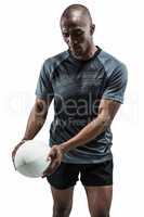 Athlete looking at rugby ball