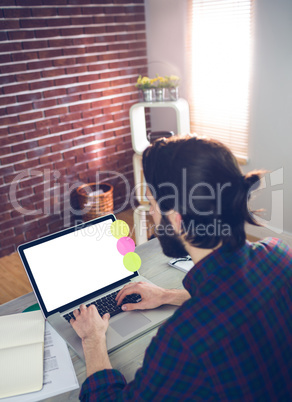 High angle view of creative editor using laptop