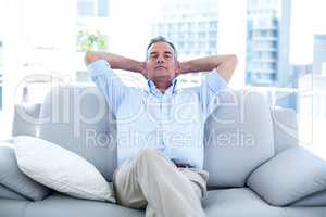 Man relaxing on sofa at home