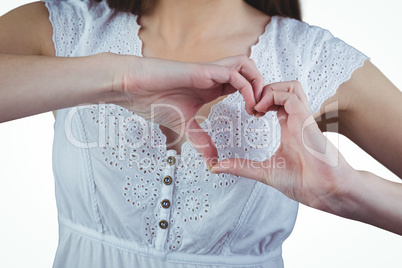 Woman making heart shape with hands