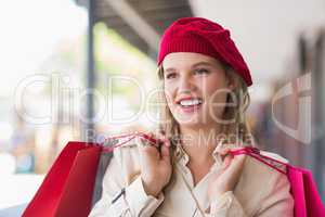 Portrait of a happy smiling woman with shopping bags