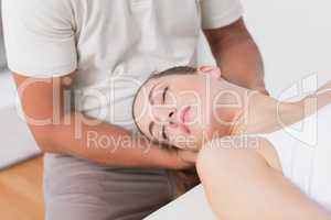 Woman receiving neck massage