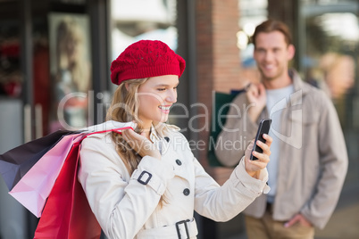 A happy couple with shopping bags