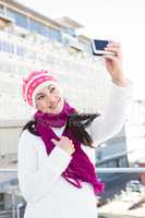 Happy woman taking a selfie