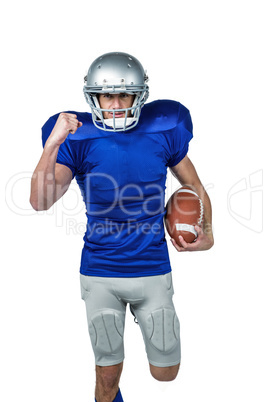 Portrait of American football player running with ball Portrait of American football player running with ball