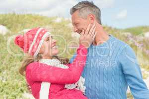 Smiling happy man carrying a woman