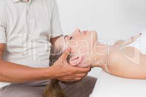 Woman receiving neck massage