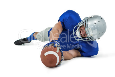 American football player reaching ball