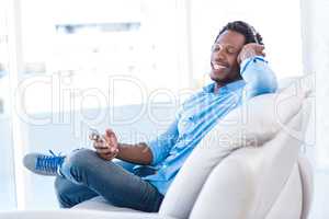 Relaxed man enjoying music