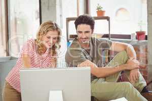 Business people using computer in office