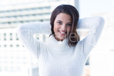 Pretty brunette smiling at camera with heads on head