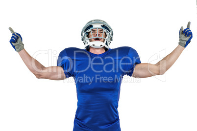 Happy American football player with arms outstretched