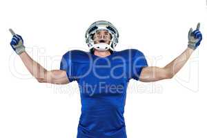 Happy American football player with arms outstretched