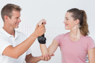 Doctor examining a woman wrist