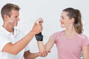 Doctor examining a woman wrist