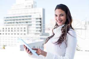 Smiling woman using tablet pc