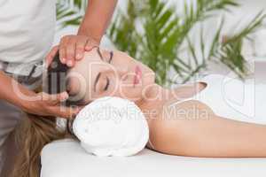 Woman receiving neck massage