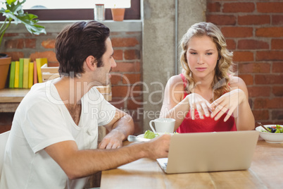 Businesswoman briefing colleague in office