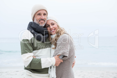 Cute couple standing and holding each other
