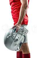 American football player holding helmet