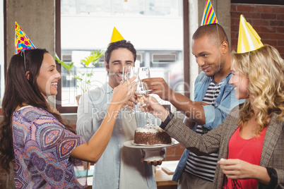 Colleagues toasting with champagne at birthday party