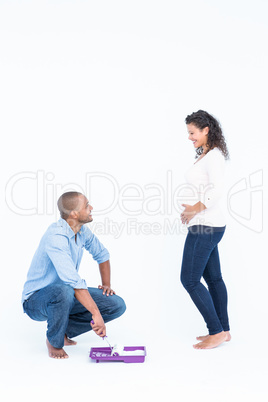 Happy husband with roller looking at wife