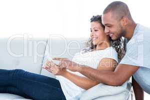 Happy couple looking at sonography
