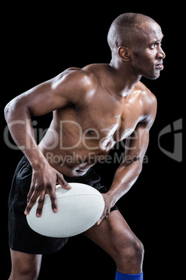 Shirtless sportsman playing while looking away