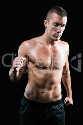 Handsome shirtless athlete running